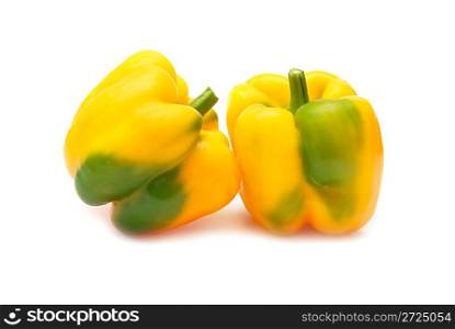 Two yellow peppers paprica (capsicum frutescens) isolated on white background