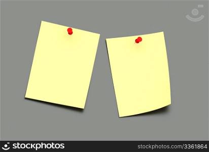 two yellow post-it on a grey background