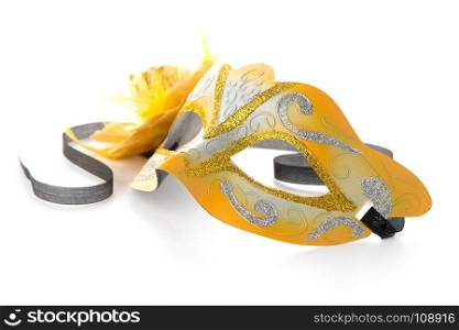 Two yellow venetian masks for a party on a white background