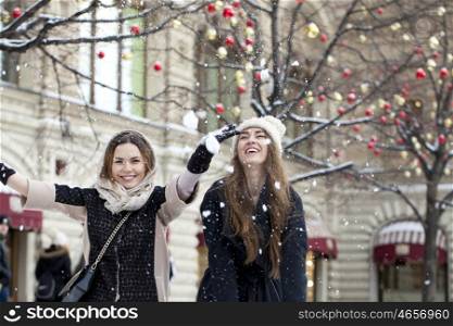 Two Young beautiful women, on background winter nature