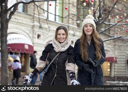 Two Young beautiful women, on background winter nature