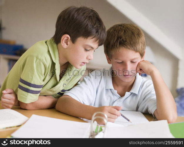 Two Young Boys Doing Their Homework Together