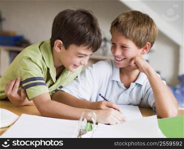 Two Young Boys Doing Their Homework Together