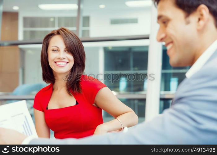 Two young business collegue talking in office. Two young business collegue in office