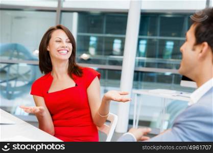 Two young business collegue talking in office. Two young business collegue in office