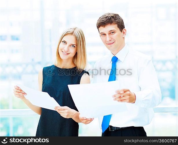 Two young business collegue working together in office
