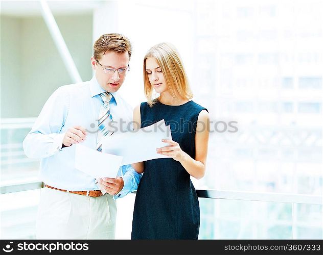 Two young business collegue working together in office