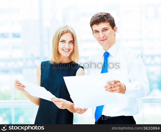 Two young business collegue working together in office