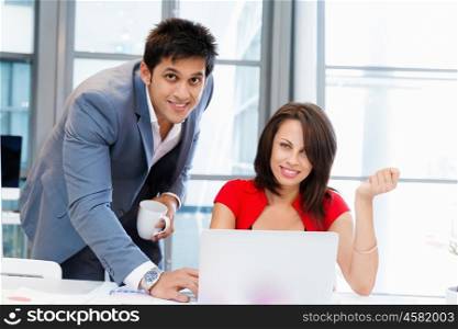 Two young business collegue working together in office. Two young business collegue in office