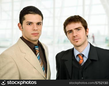 two young business men portrait at the office