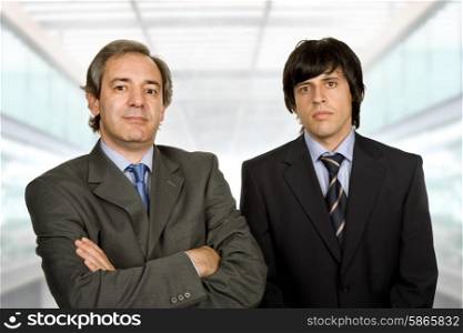 two young business men portrait, at the office