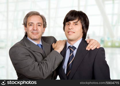 two young business men portrait at the office