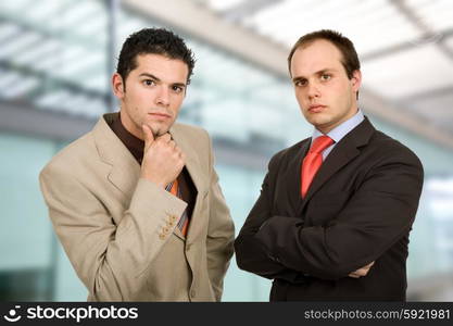 two young business men portrait, at the office