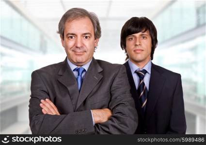 two young business men portrait at the office