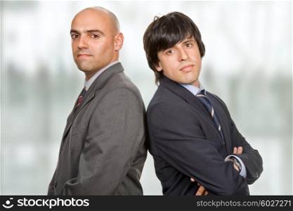 two young business men portrait at the office