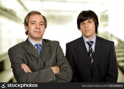 two young business men portrait, focus on the right man
