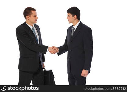 Two young businessmen greet