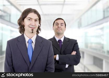two young businessmen portrait at the office