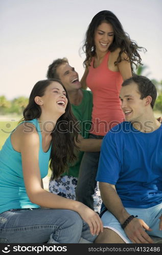 Two young couples smiling