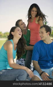 Two young couples smiling