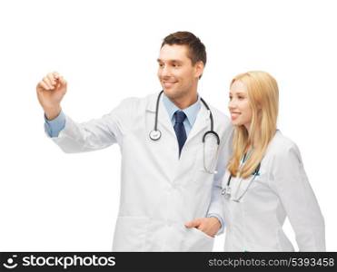 two young doctors working with something imaginary
