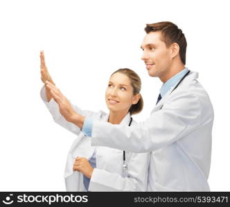 two young doctors working with something imaginary