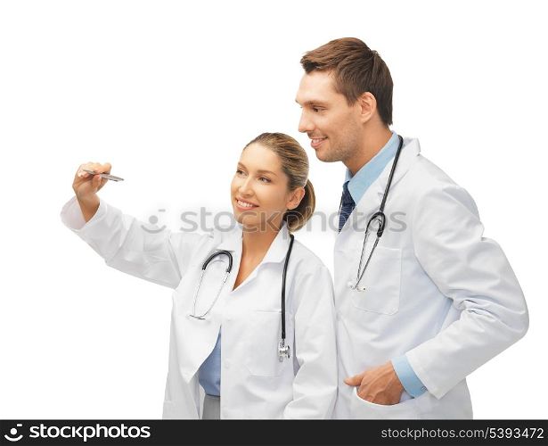 two young doctors working with something imaginary