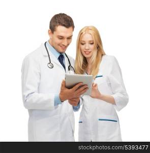 two young doctors working with tablet pc