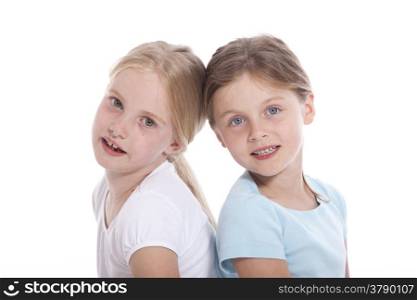 two young female friends against white background