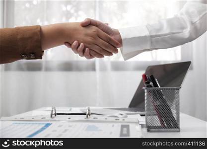 two young female professional shaking hand business concept