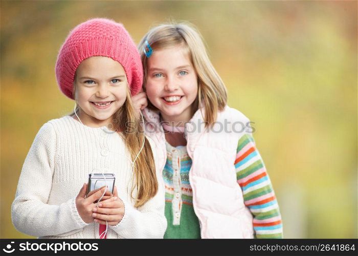 Two Young Girl Outdoors With MP3 Player