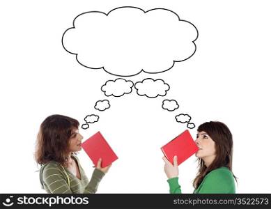 Two young girls thinking with books isolated over white