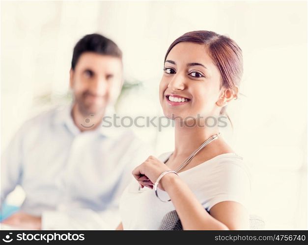 Two young happy collegues in offfice
