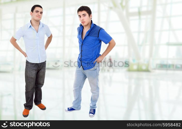 two young happy teenagers standing