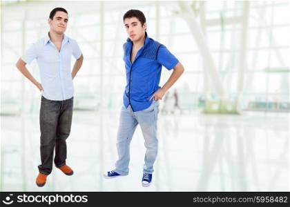 two young happy teenagers standing