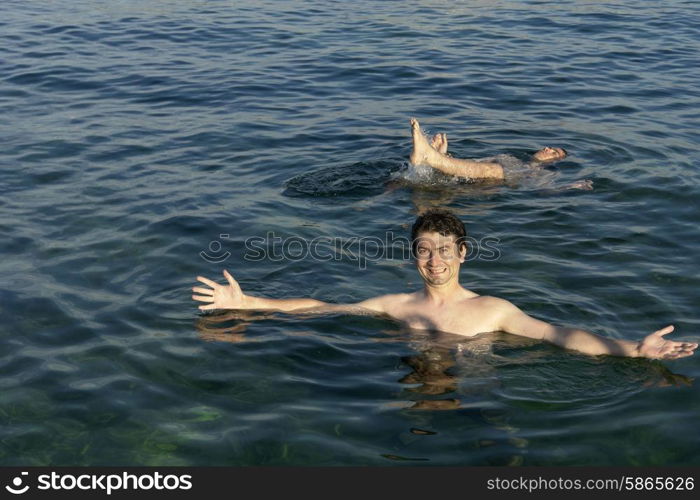 two young men at the mediterranean ocean