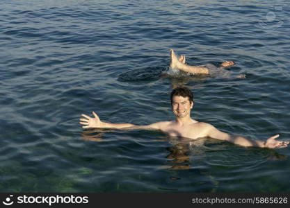 two young men at the mediterranean ocean