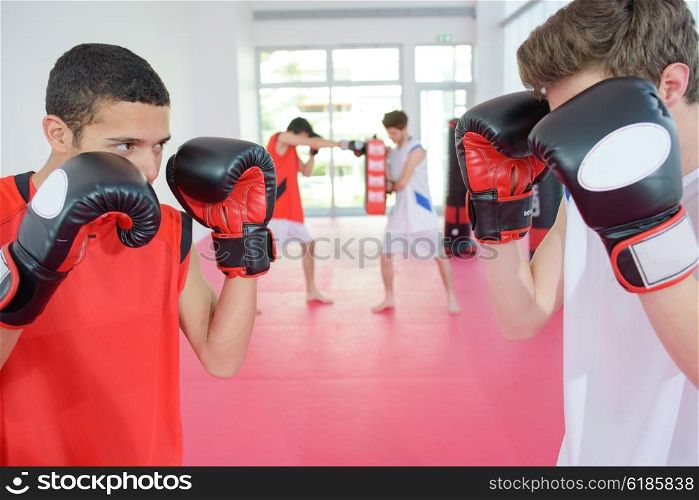 Two young men boxing