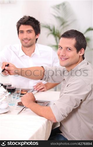two young men having lunch