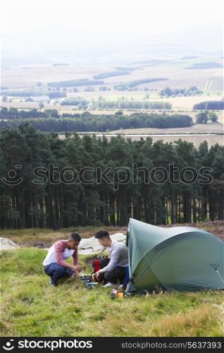 Two Young Men On Camping Trip In Countryside