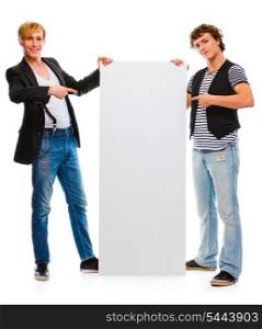 Two young men pointing on blank billboard. Isolated on white&#xA;