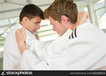 Two young men practicing a martial art