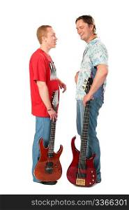 Two young men stand with guitars