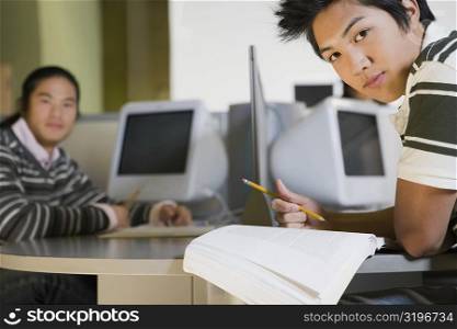 Two young men studying in a computer lab