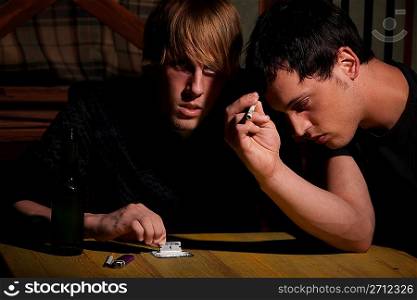 Two young men with heroin or cocaine