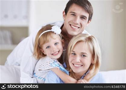 Two young parents with baby daughter