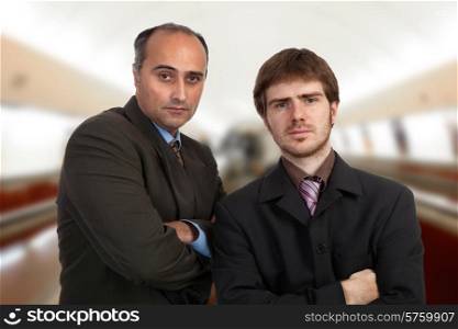 two young pensive business men portrait standing