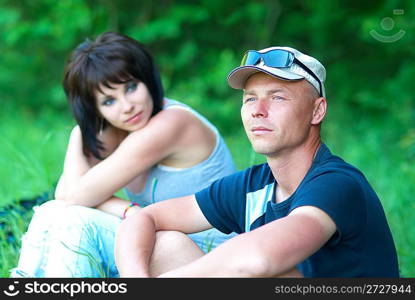 Two young people on the green field