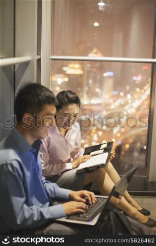 Two young people working in the office