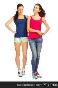 Two young smiling sporty girls isolated